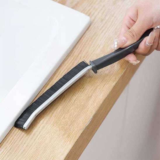 Brosse de nettoyage Coin-Net pour rebords de meubles